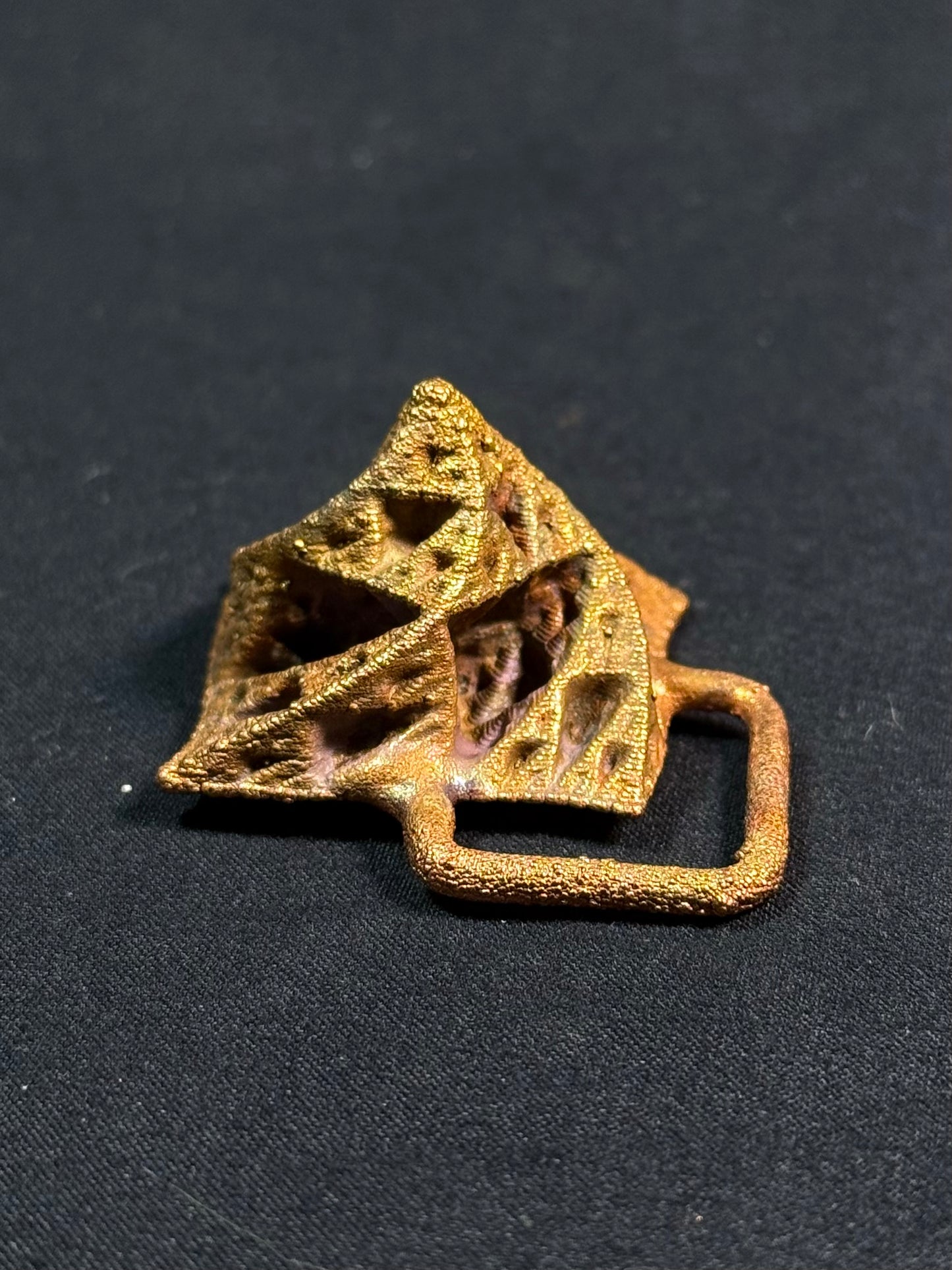 Warped pyramid amulet