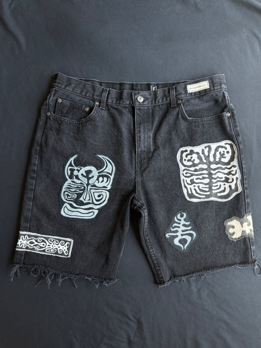 Black and white patch black jean shorts
