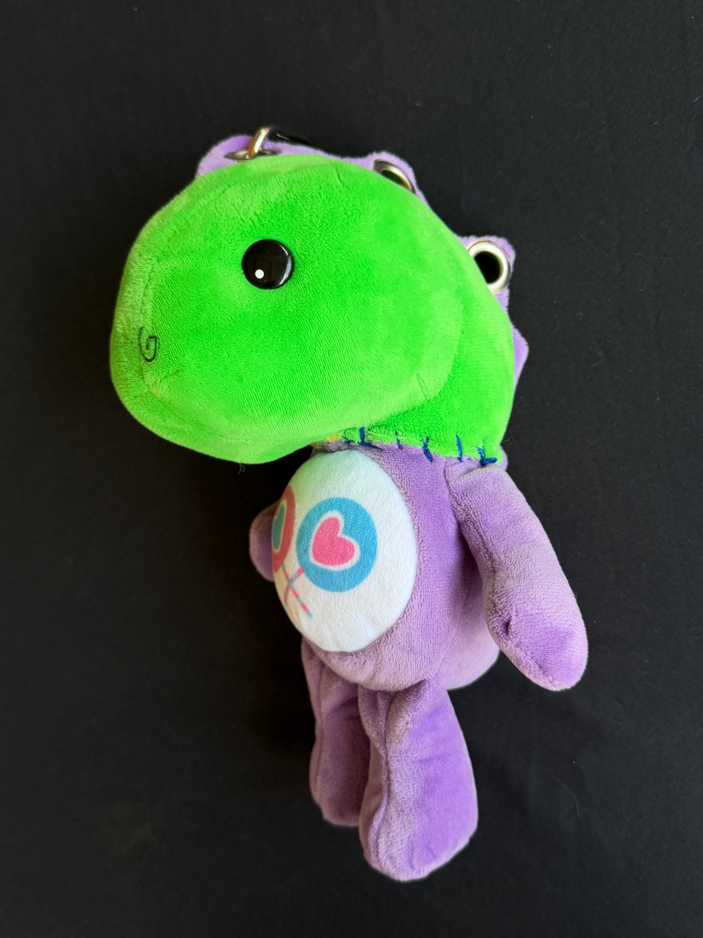 Dinosaur + purple care bear keychain buddy