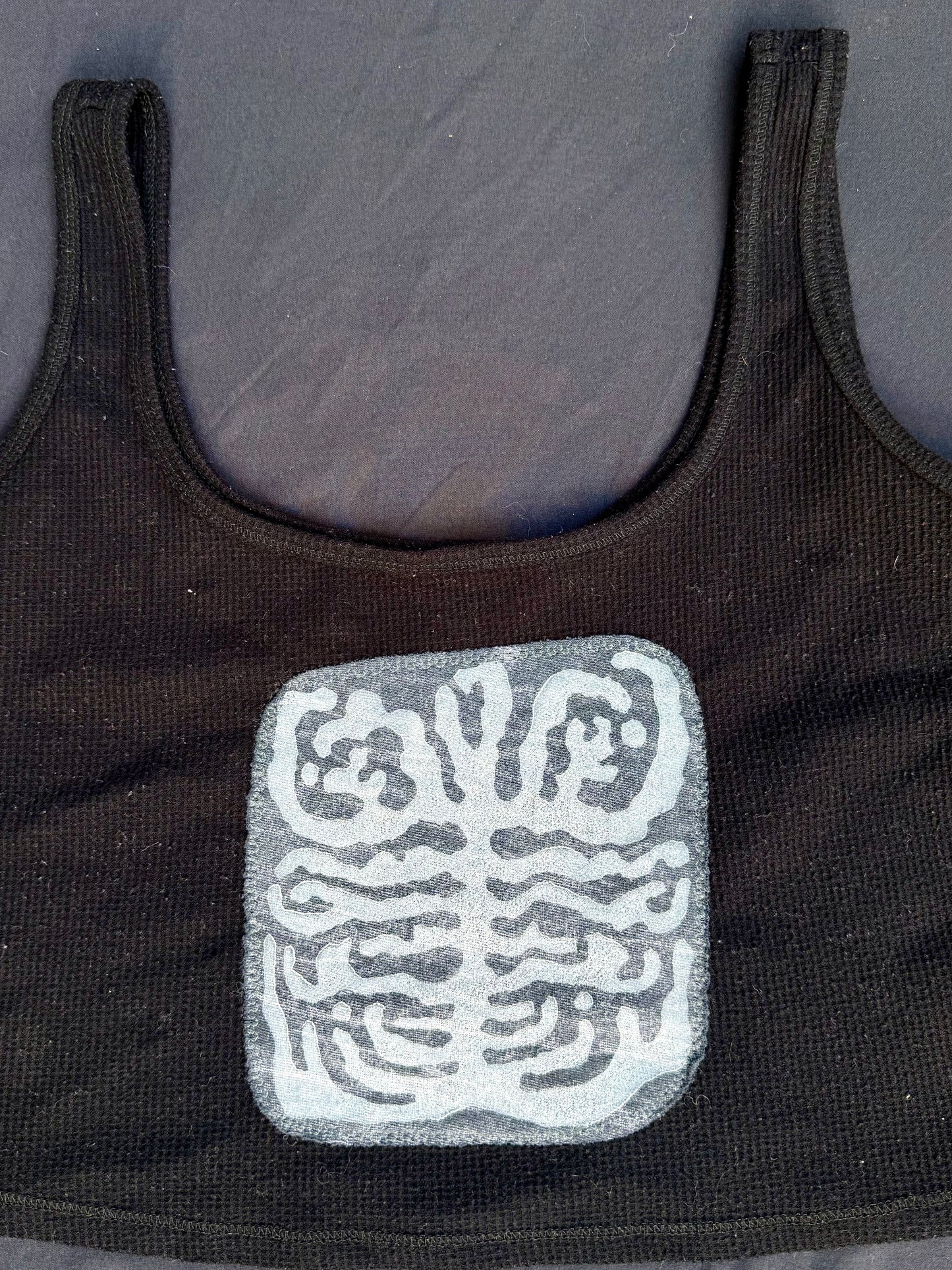 Shape patch tank top