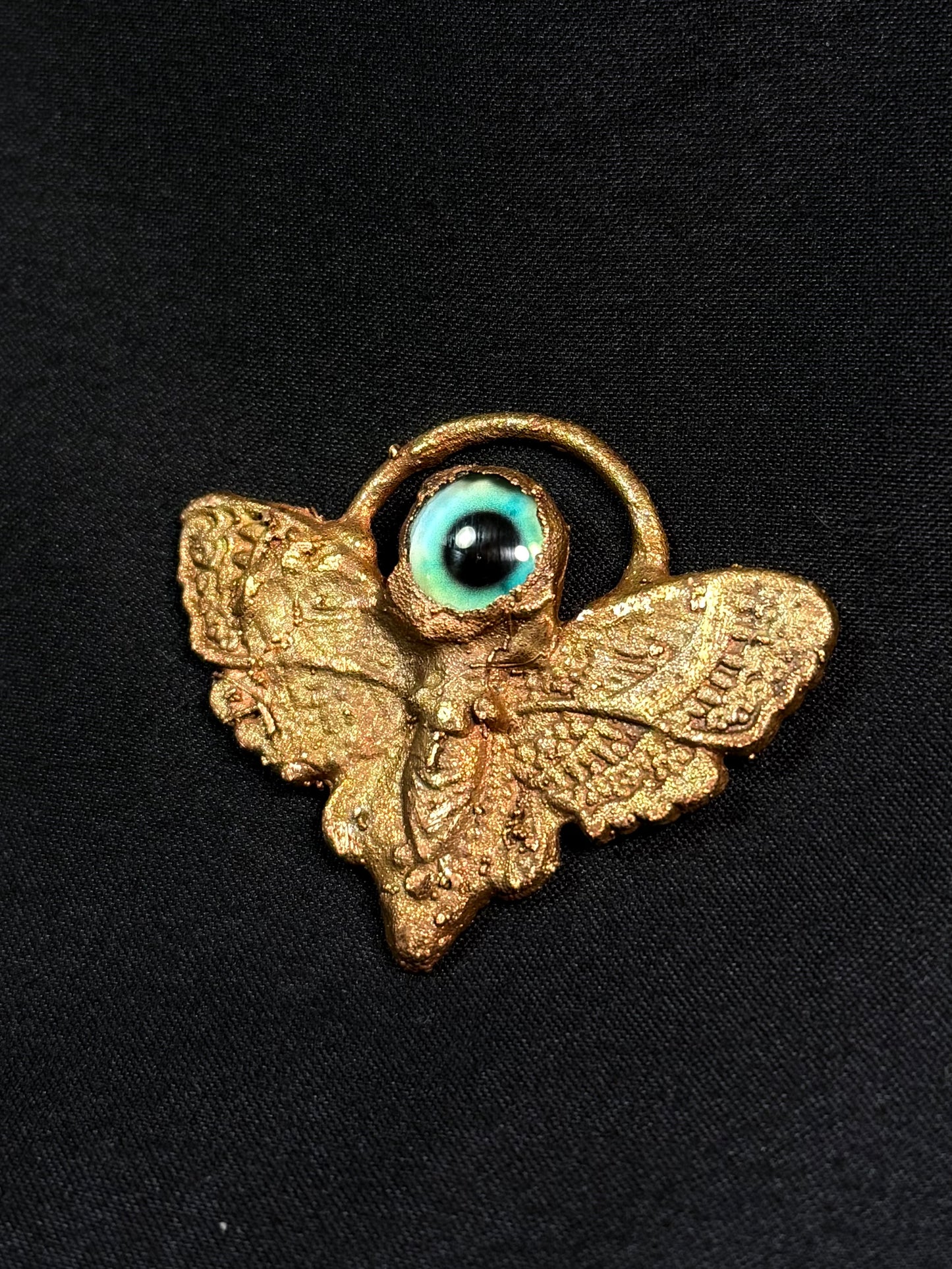Eye moth amulet