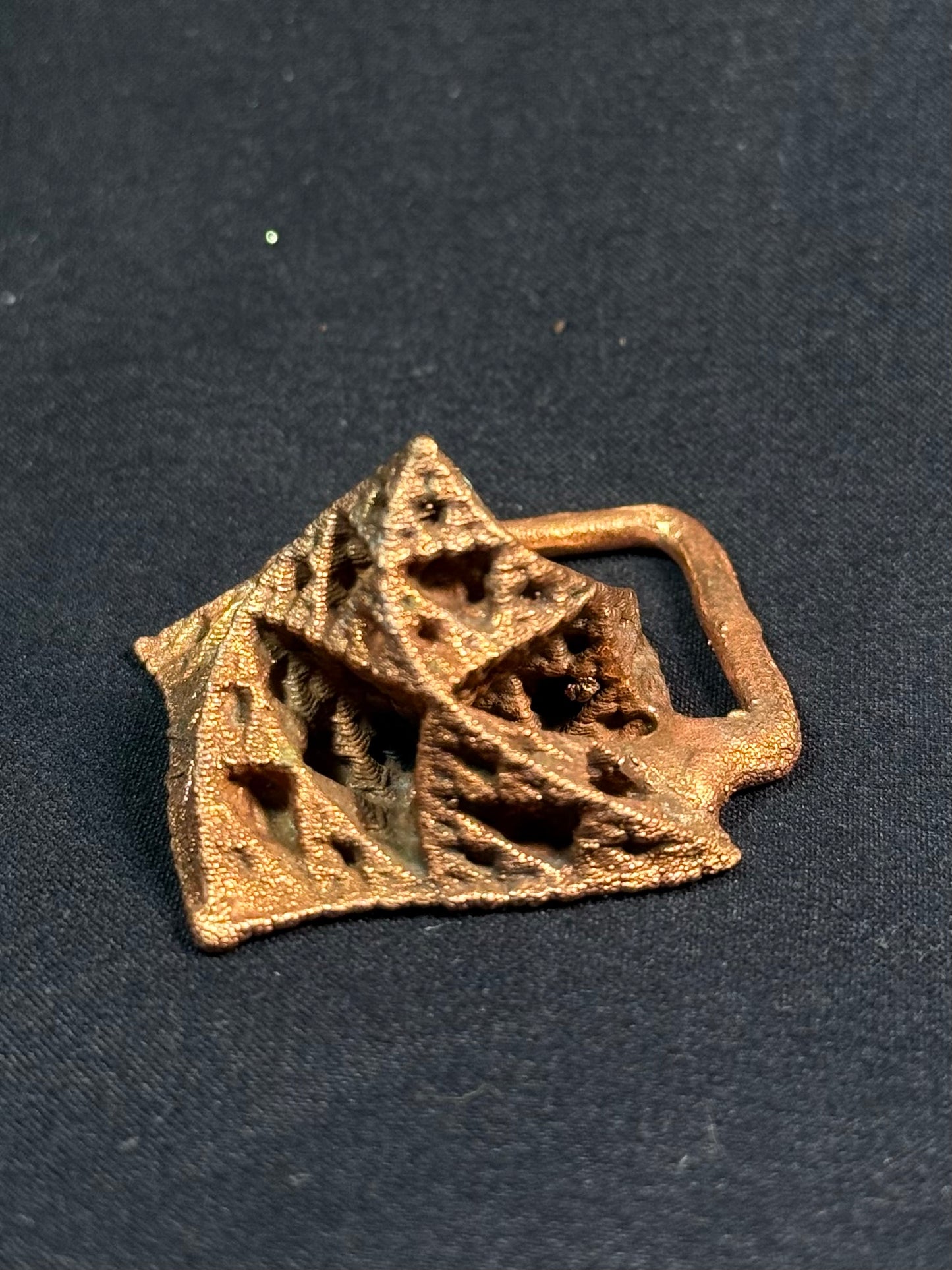 Warped pyramid amulet