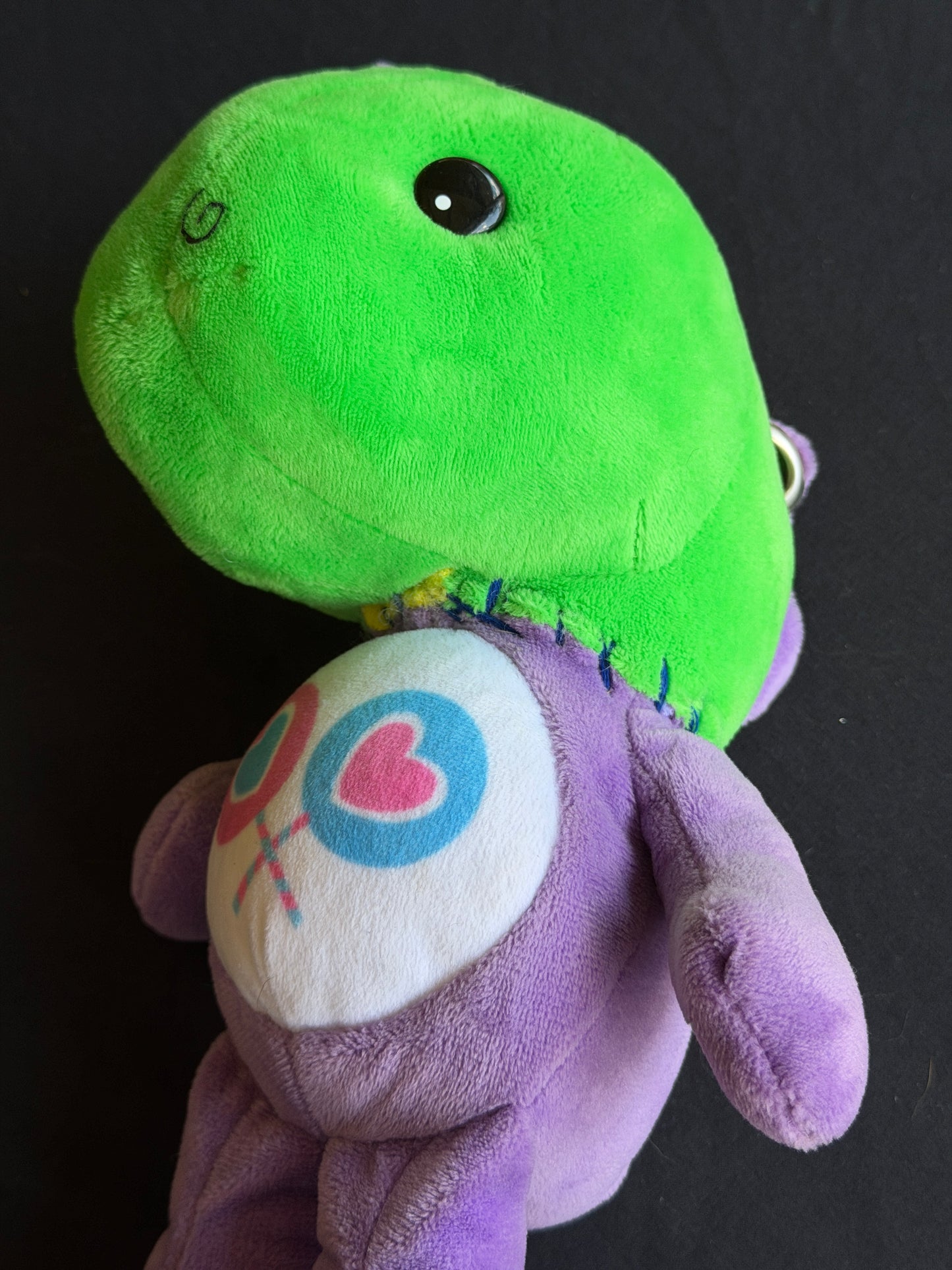 Dinosaur + purple care bear keychain buddy