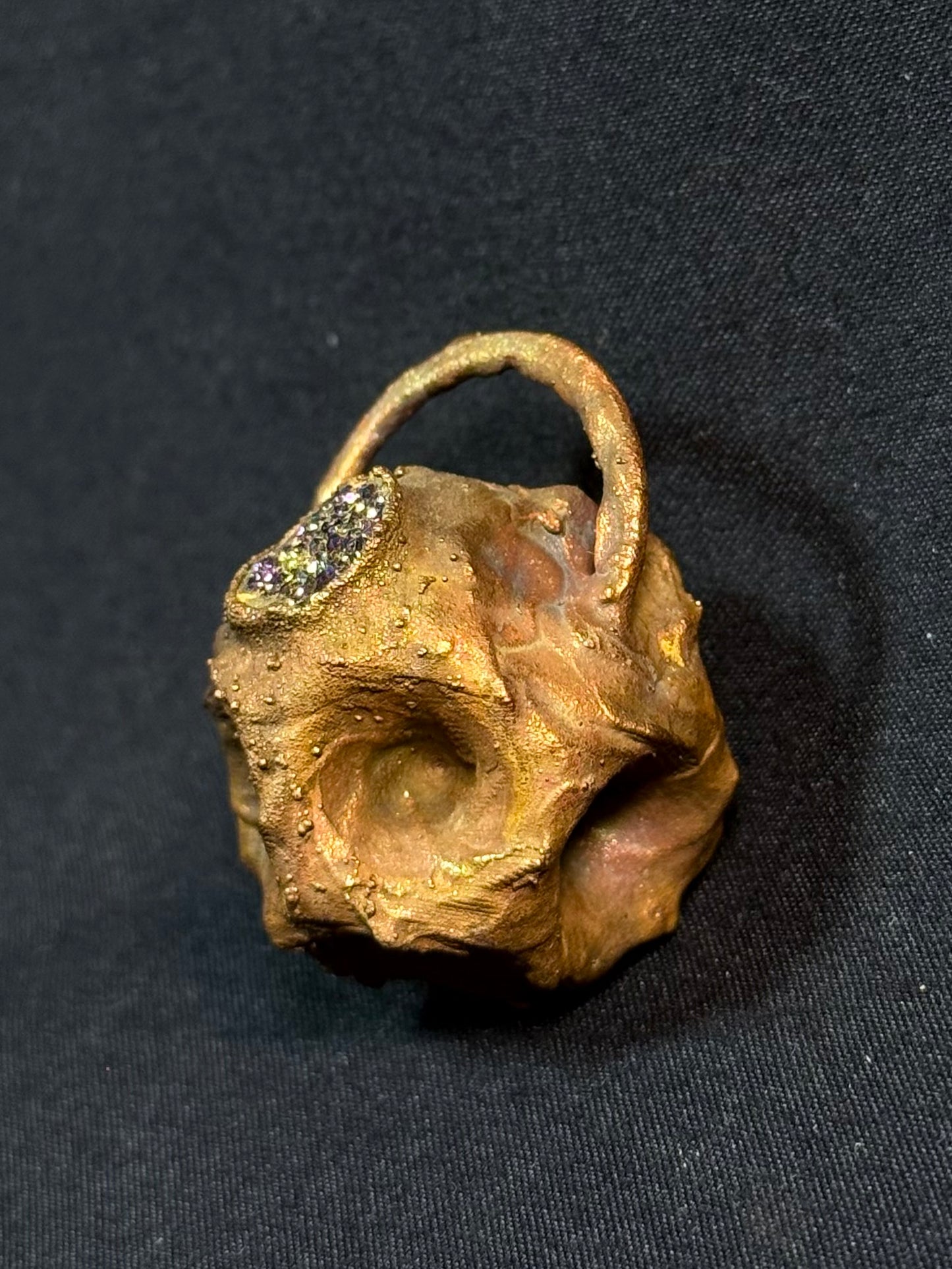 Tessellated rose quartz amulet