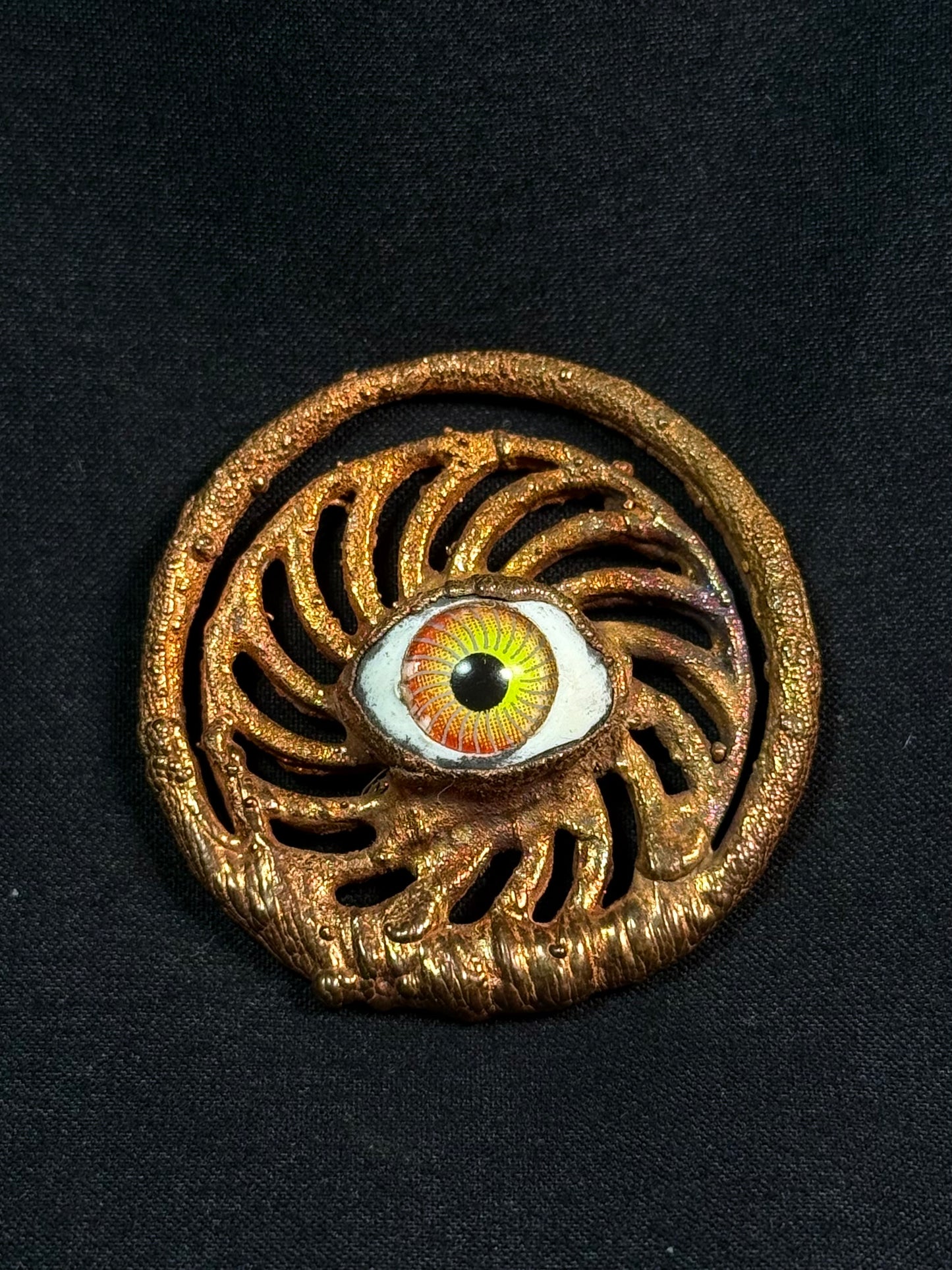 Eye spiral amulet