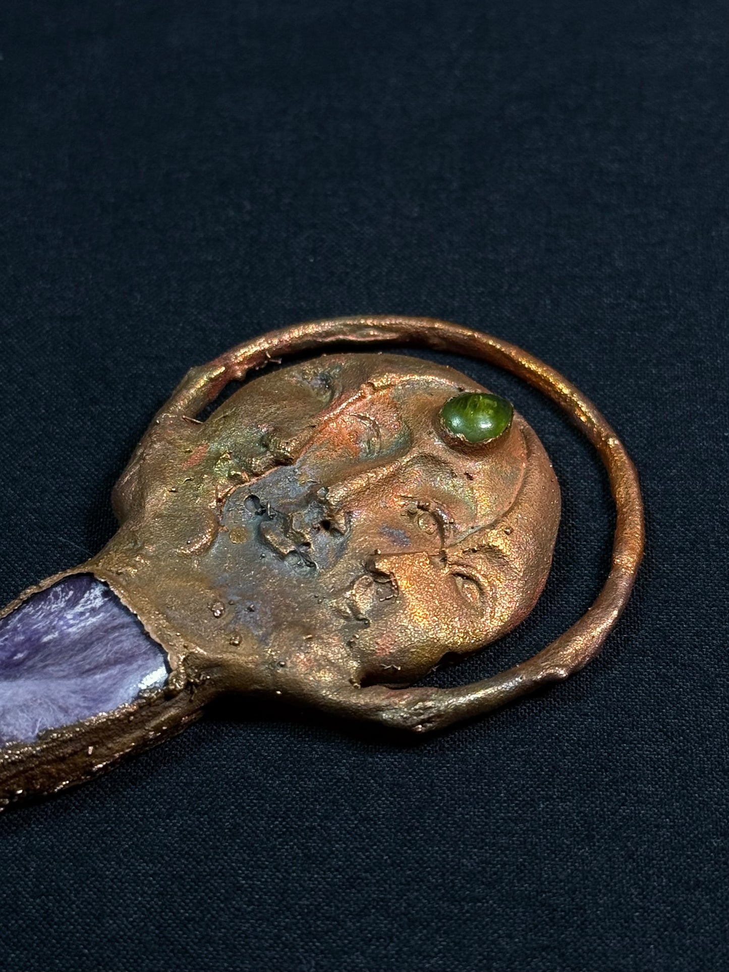 The sun and moon charoite amulet