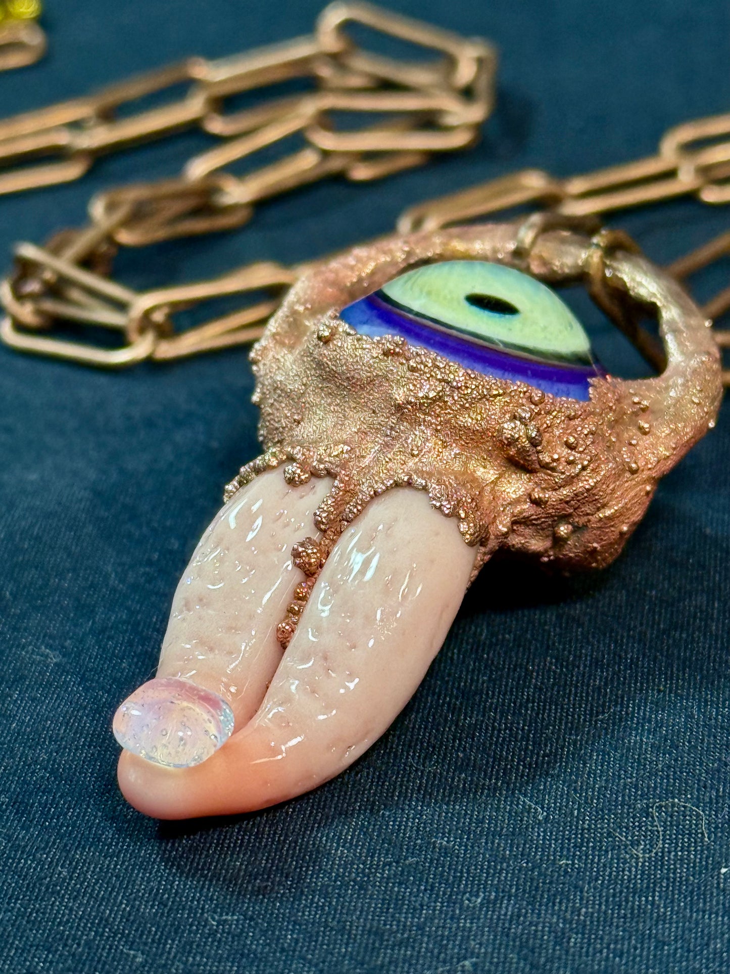 Glass tongue and eye amulet