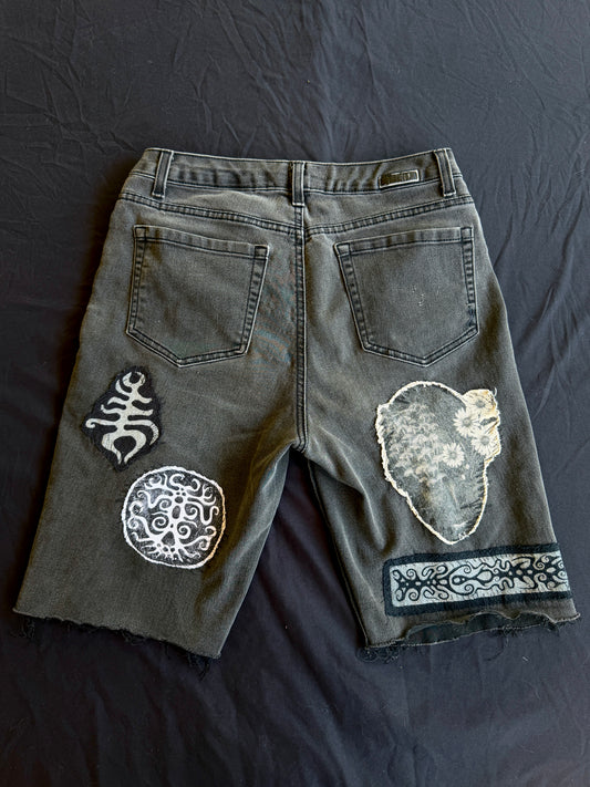 Black and white patch black jean shorts