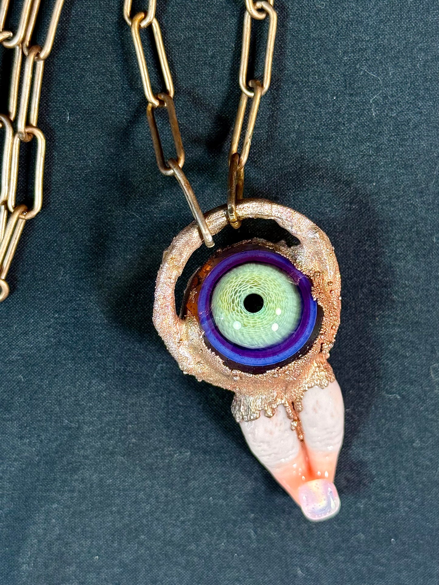 Glass tongue and eye amulet