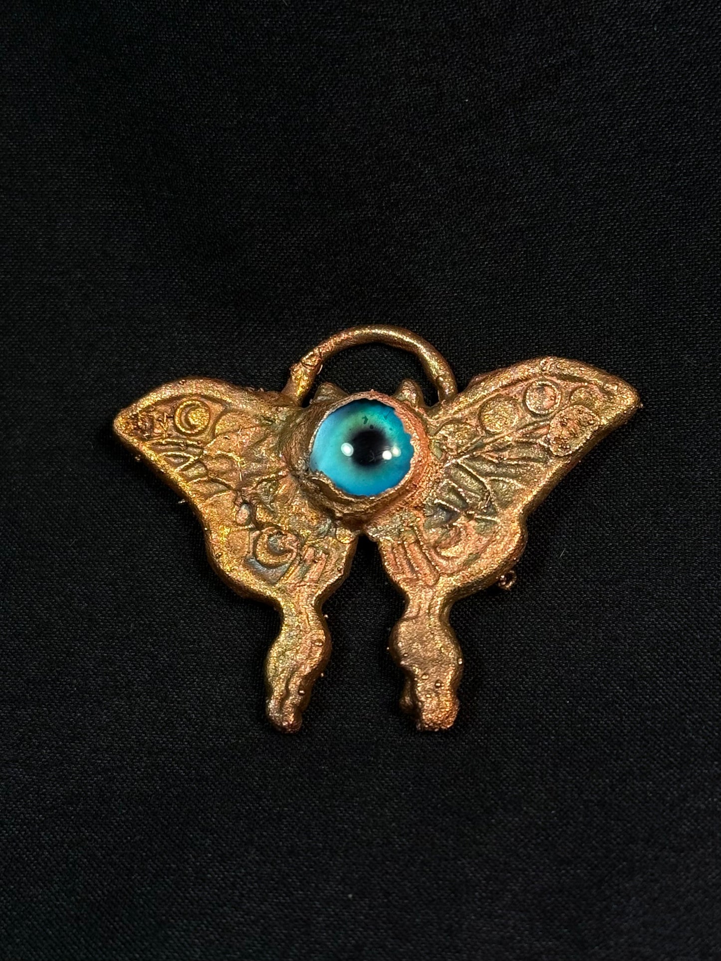 Eye butterfly amulet