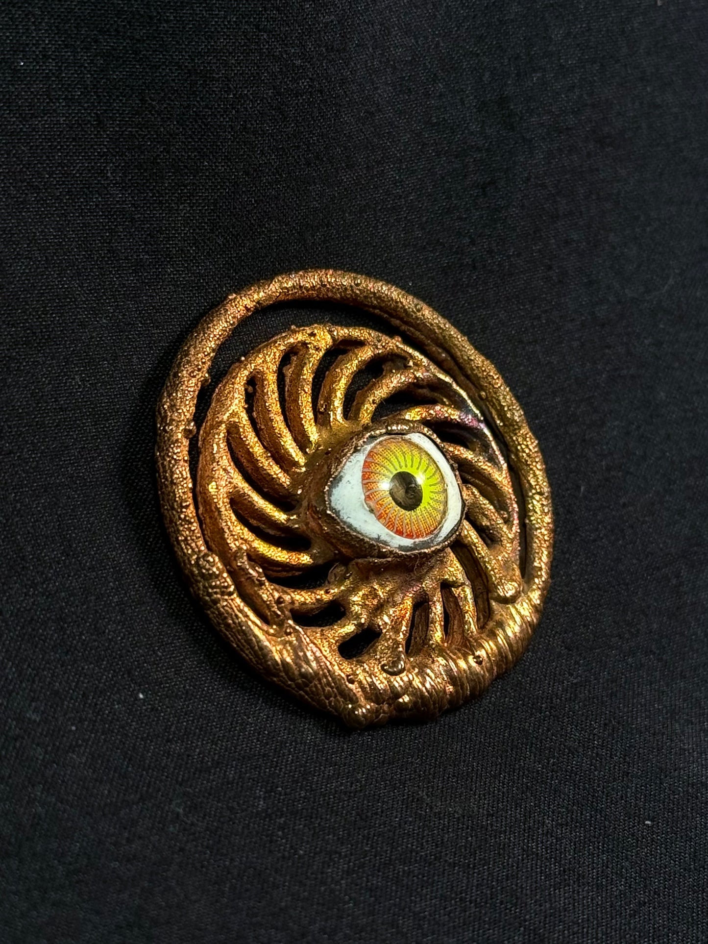 Eye spiral amulet