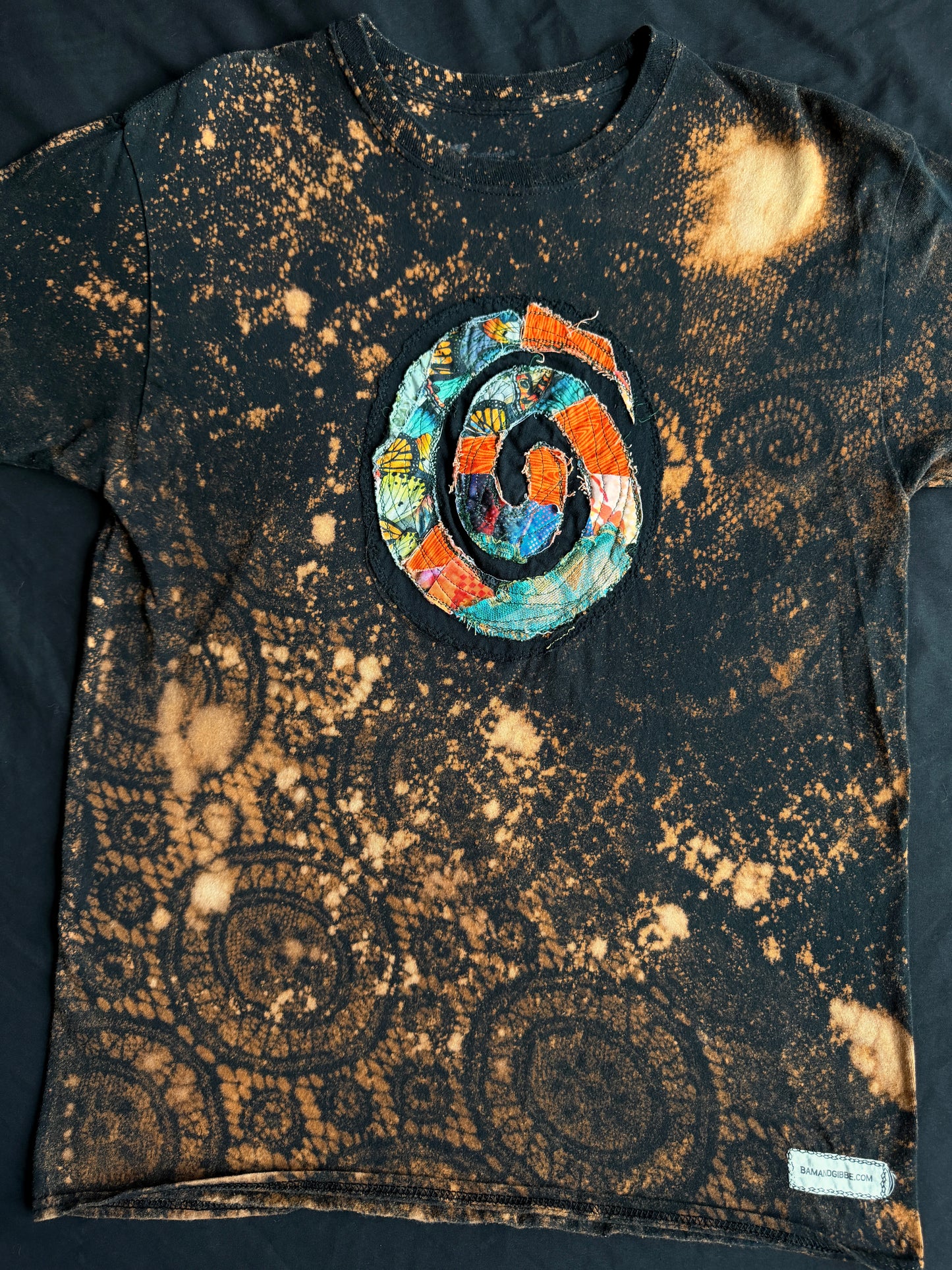 Spiral patch bleach dyed t-shirt