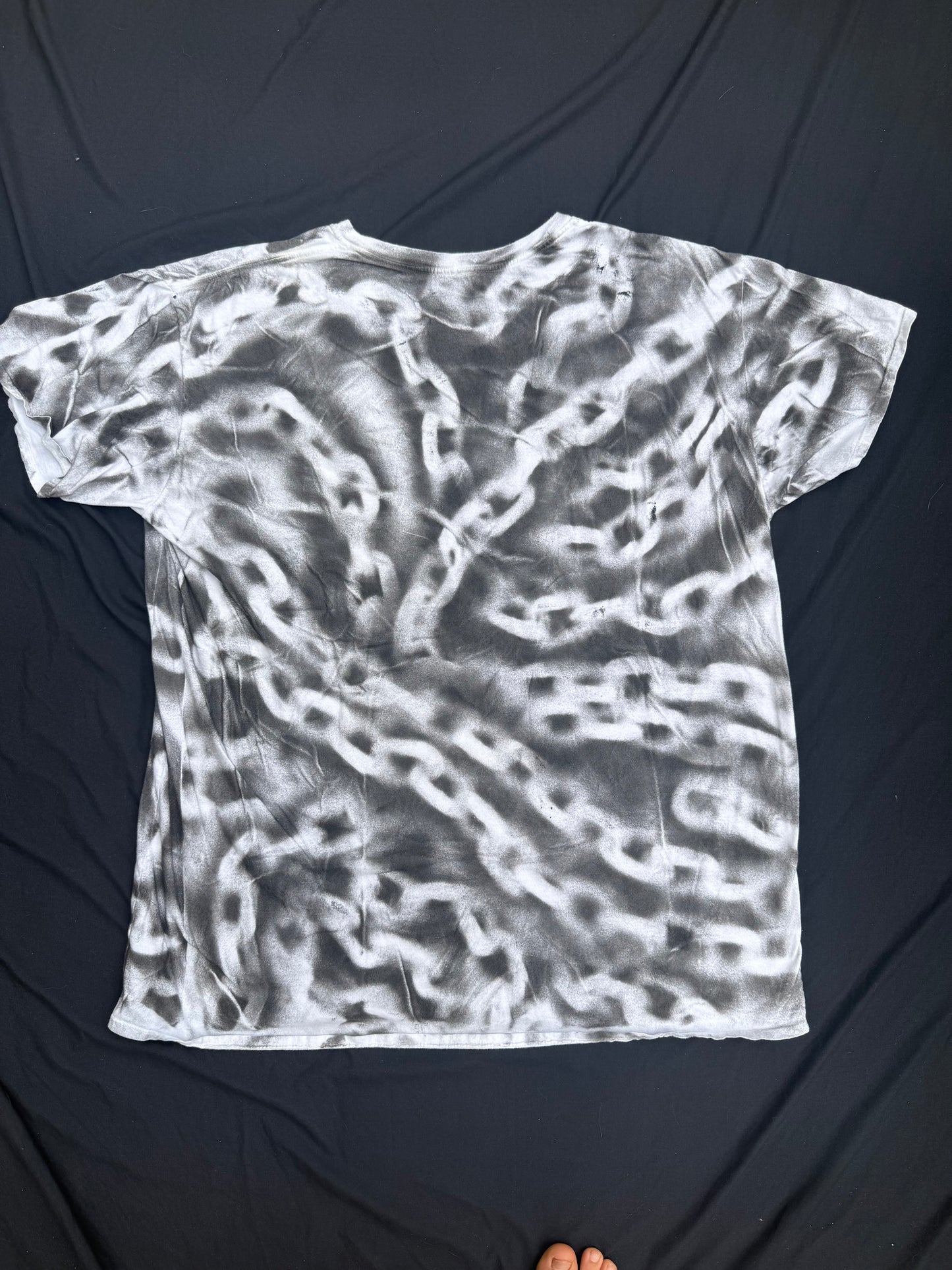 All seeing billy skull chain sprayed t shirt