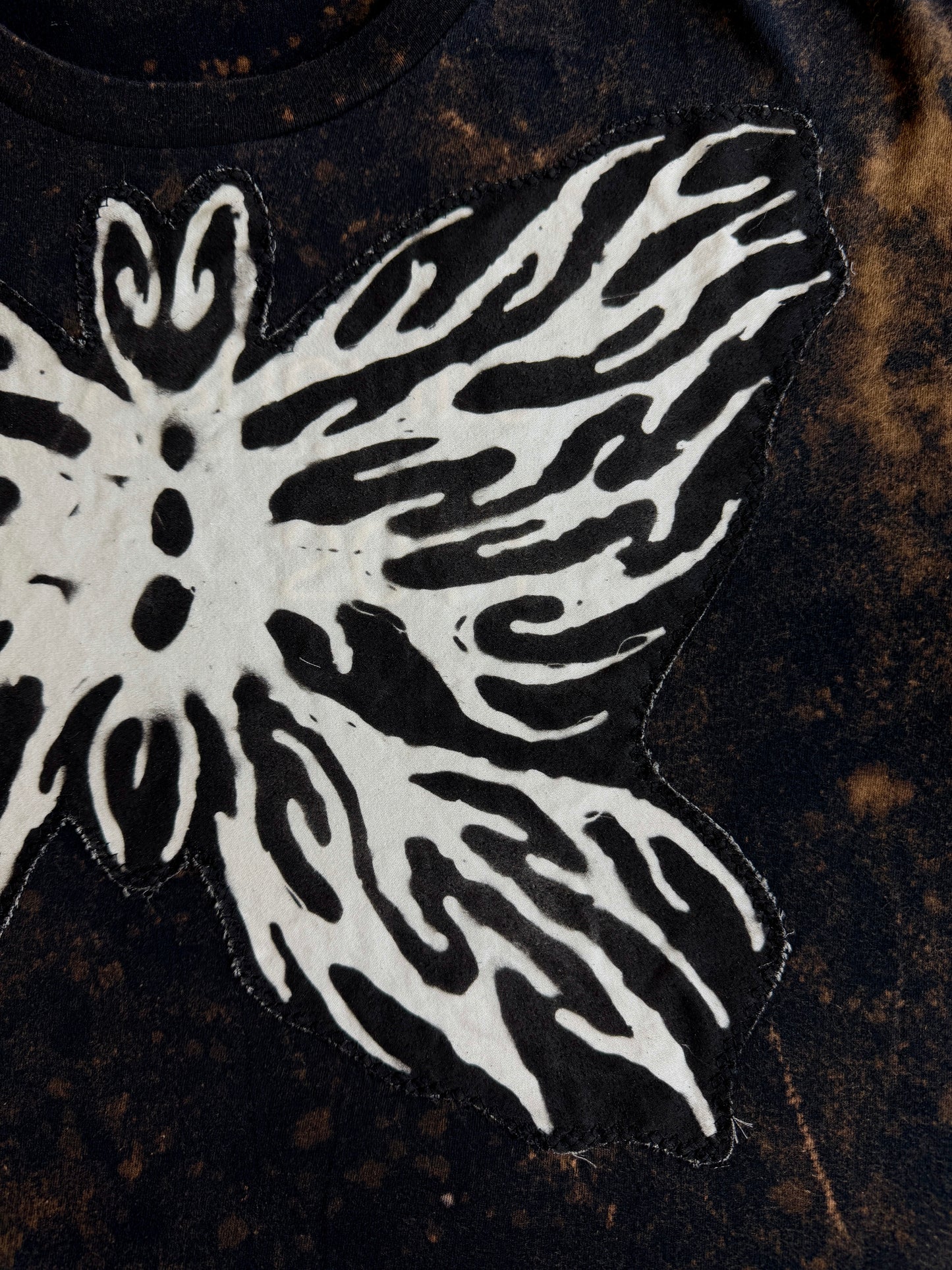 Abstract butterfly + shape bleach dyed t-shirt